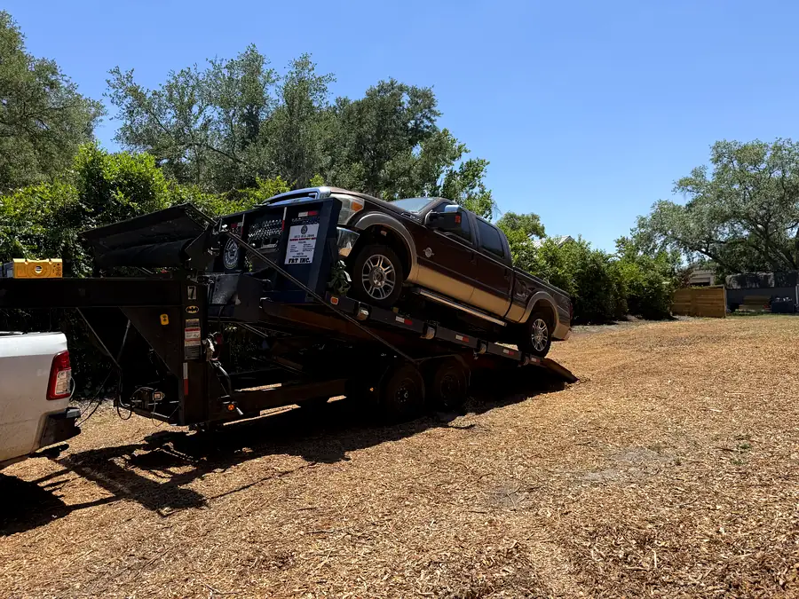 A pickup truck loaded on the gooseneck trailer